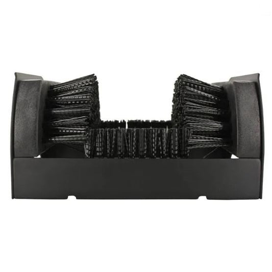 A black Yaktrax Boot Scrubber with bristles designed to scrub dirt off the soles of boots and shoes.