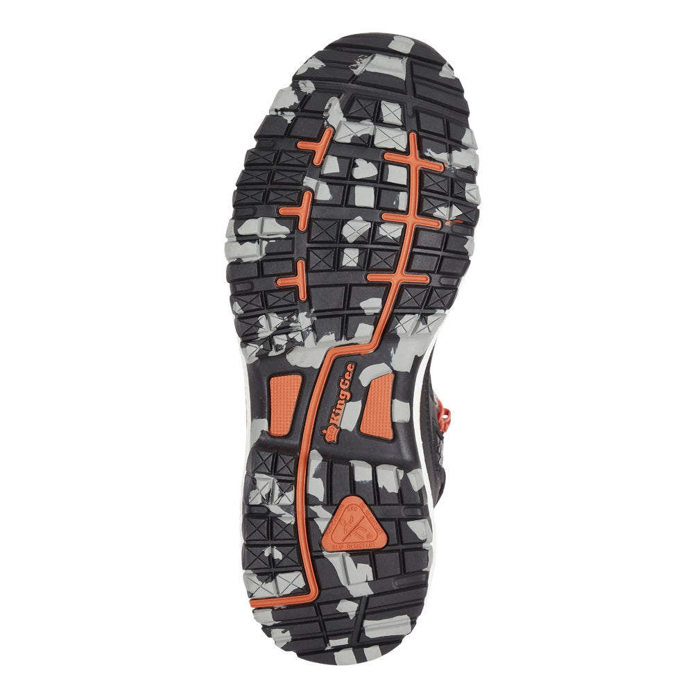 Close-up of a shoe sole with orange and gray pattern on a white background