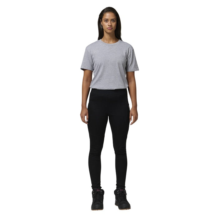 Person wearing a gray t-shirt and black leggings on a white background