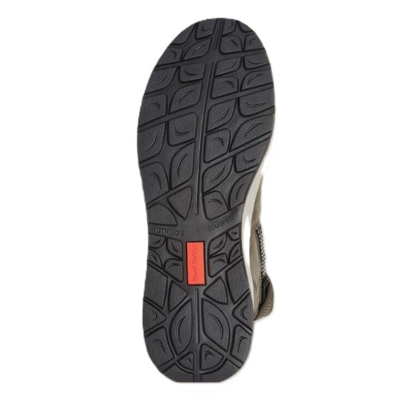 Sole of a shoe with tread pattern and a red label on a white background
