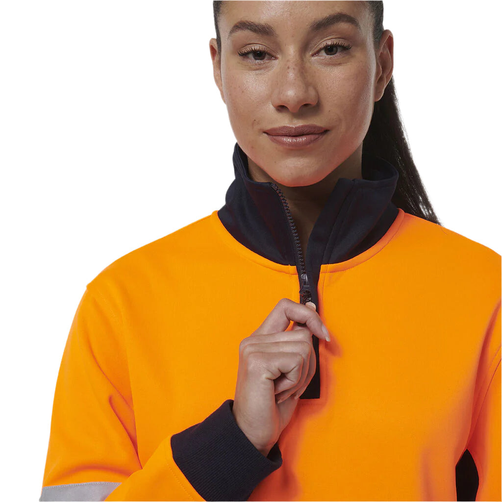 Person wearing an orange jacket with a black zipper on a white background
