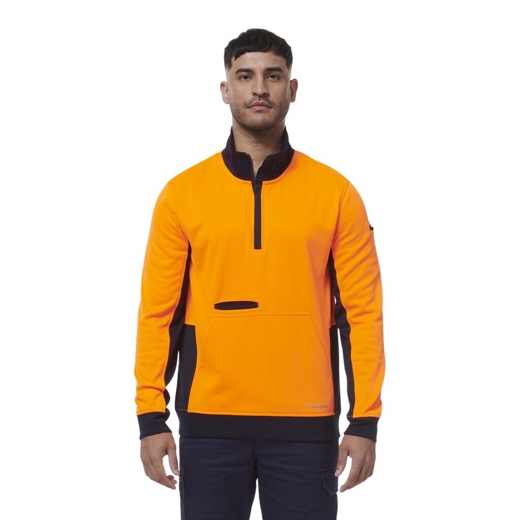 Man wearing an orange and black PULLOVER on a white background
