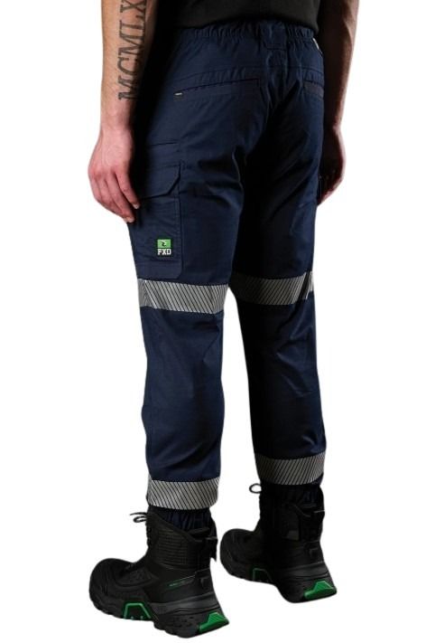 Navy work pants with reflective stripes worn by a person on a white background