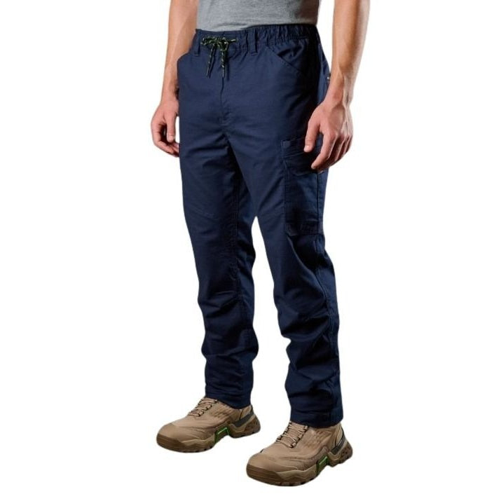 Person wearing navy blue cargo pants on a white background