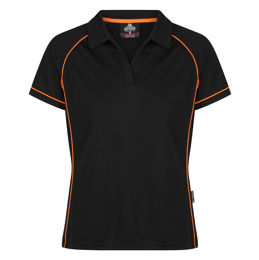 A black Aussie Pacific Endeavour ladies polo shirt with orange contrast piping and a V-neck collar.