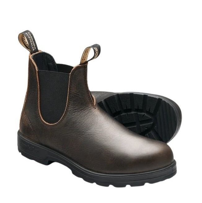 Brown leather Chelsea boots with a white background