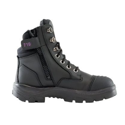 A black Steel Blue ladies safety boot with a scalloped collar, padded tongue, and side zipper. It features a lace-up front and a steel toe cap.