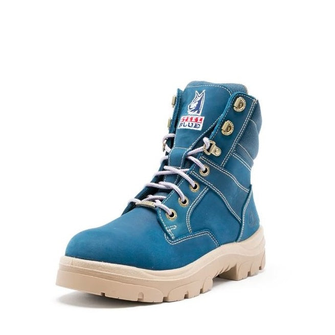 Blue boot with beige sole on a white background
