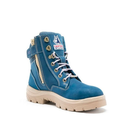 Blue boot with beige sole on a white background