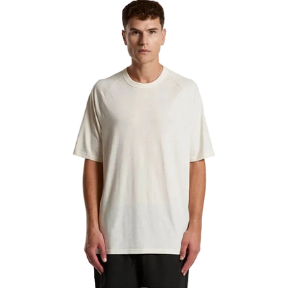 Mens ECRU coloured relaxed fit, AS Colour 5610 Staple Active Blend Tee, model front view