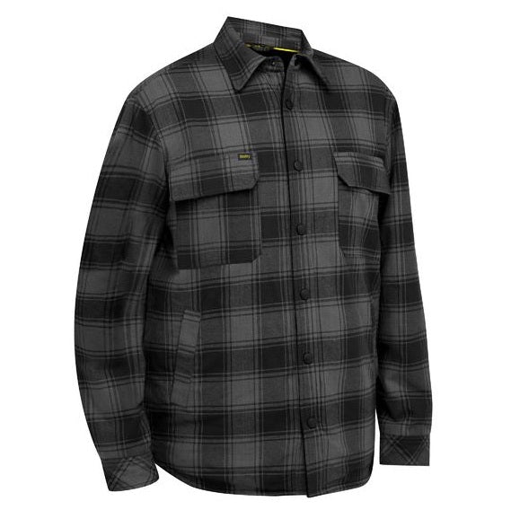 Plaid shirt with two front pockets on a white background
