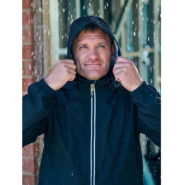 Man wearing a black hooded jacket in a rainy outdoor setting