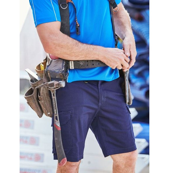 Person wearing a tool belt with various tools on a blurred background