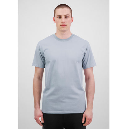 Person wearing a plain light gray t-shirt on a white background