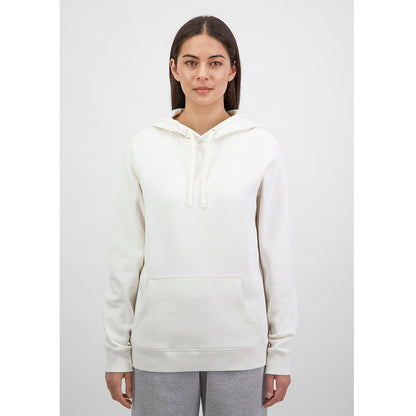 Person wearing a white hoodie and gray pants on a white background