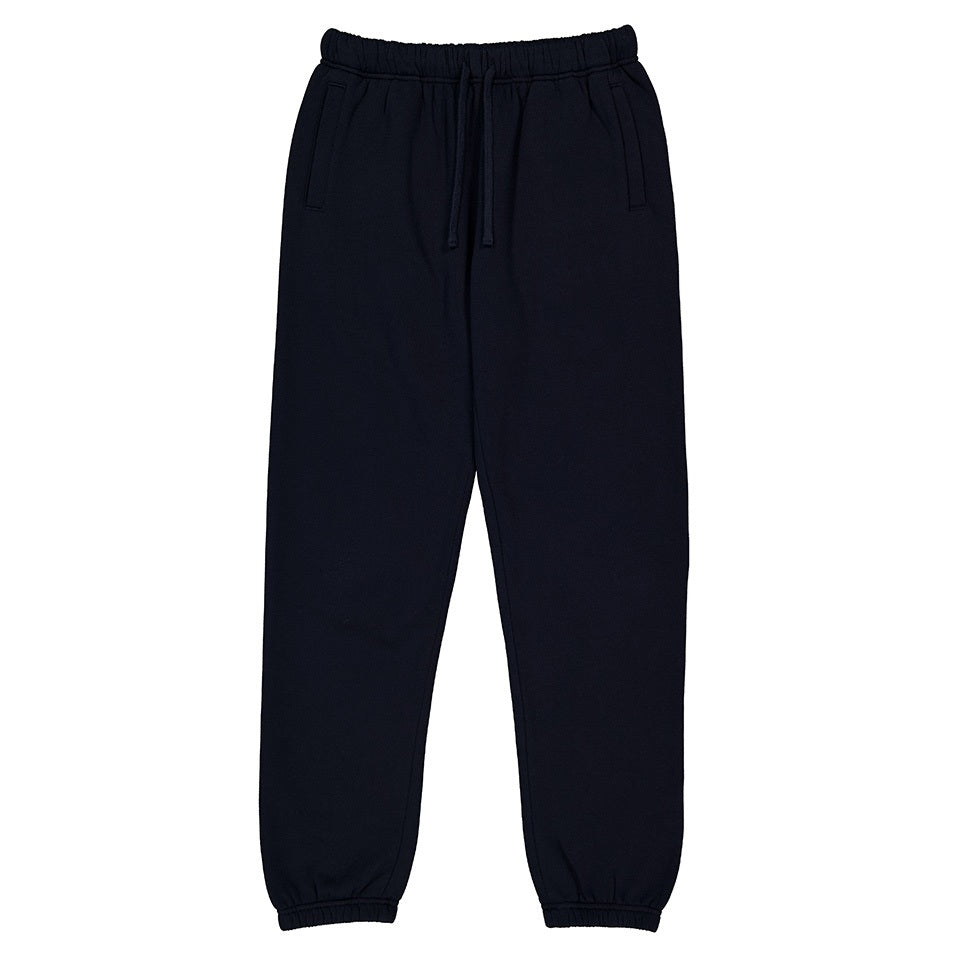 Navy track pants on white background