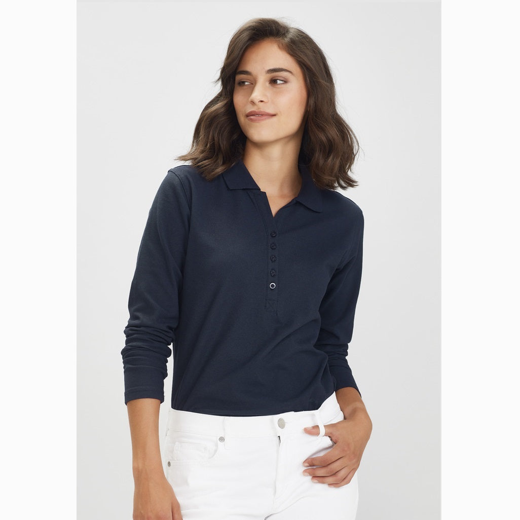 A professional woman wearing a navy long-sleeved polo shirt with a collar, featuring a Y-placket design.