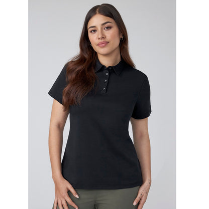 Woman wearing a black polo shirt against a plain background