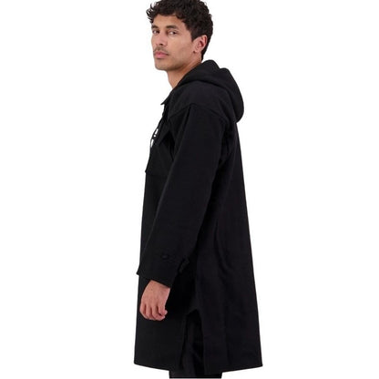 Man wearing a black hooded cloak on a white background