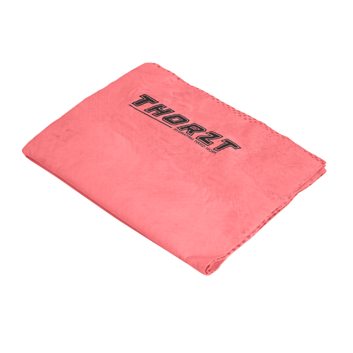A folded coral pink chill cloth with the brand name 'THORZT' printed in black across the top, shown on a plain white background.