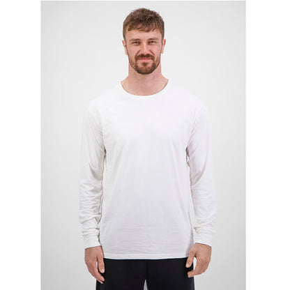 Man wearing a white long-sleeve shirt against a plain background