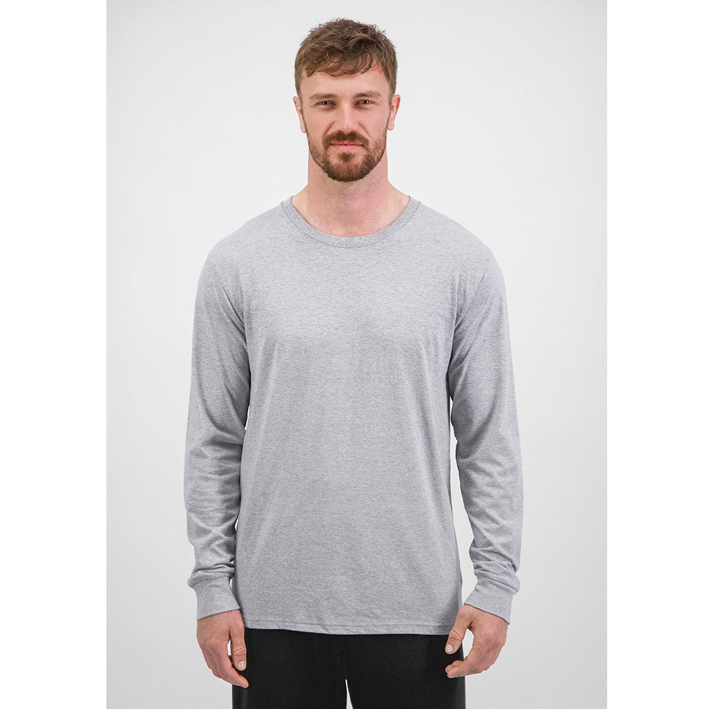 Man wearing a gray long-sleeve shirt against a white background