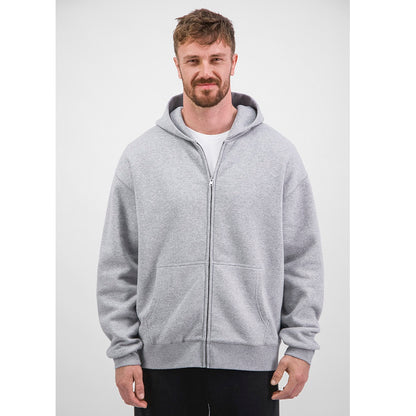 Man wearing a gray zip-up hoodie on a white background