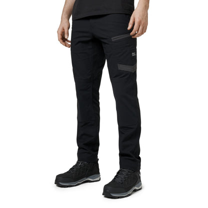 Person wearing black pants and black shoes on a white background