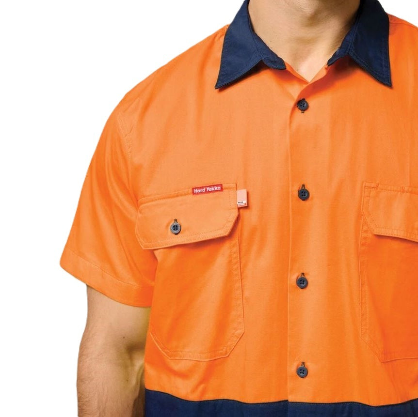 Orange work shirt with navy collar and buttons on a white background