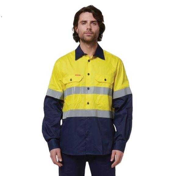 Person wearing a high-visibility yellow and navy work shirt on a white background
