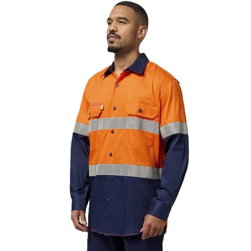 Man wearing a high-visibility orange and navy work jacket on a white background