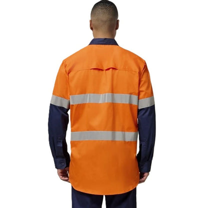 Person wearing an orange and navy high-visibility work shirt on a white background