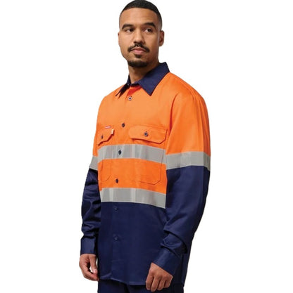 Person wearing an orange and navy high-visibility work shirt on a white background