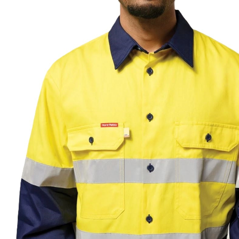 Yellow and navy work jacket with reflective stripe on a white background