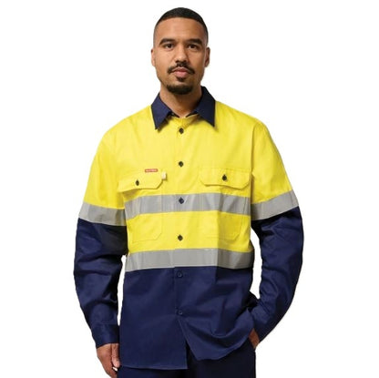 Person wearing a high-visibility yellow and blue work shirt on a white background