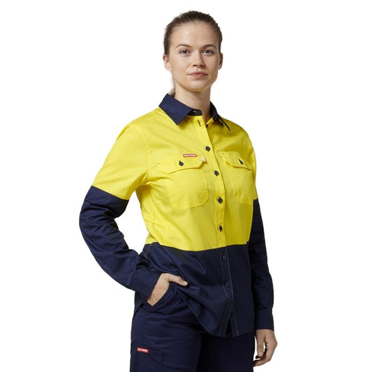 Person wearing a yellow and navy work shirt on a white background