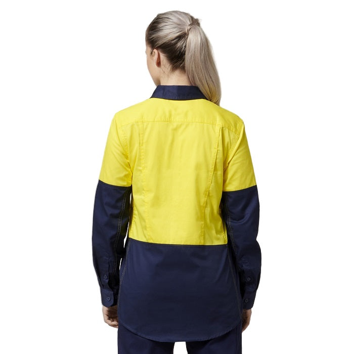 Person wearing a yellow and navy work shirt on a white background