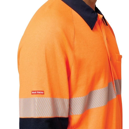 Orange high-visibility work shirt with reflective stripes on a white background
