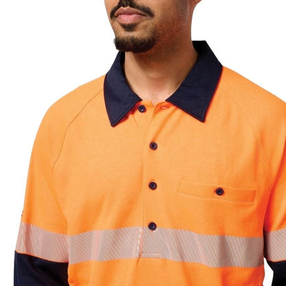 Orange work shirt with reflective stripes worn by a person on a white background
