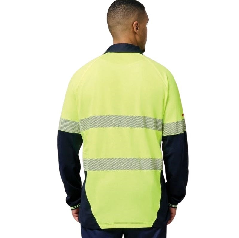 Person wearing a high-visibility safety shirt with reflective stripes on a white background