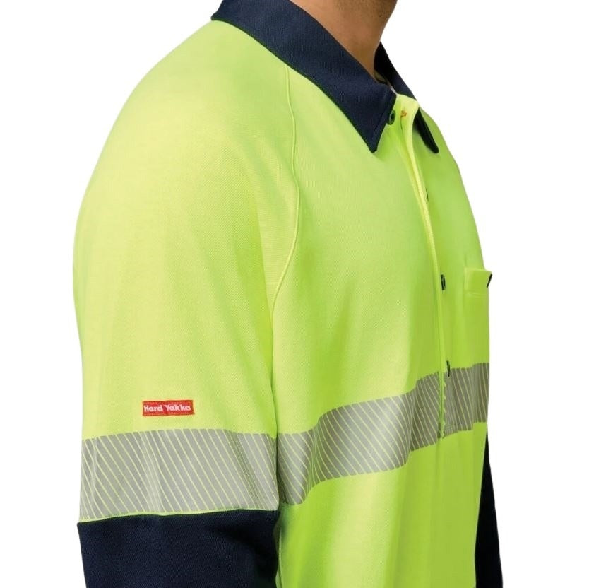 High-visibility safety shirt with reflective stripes on a white background