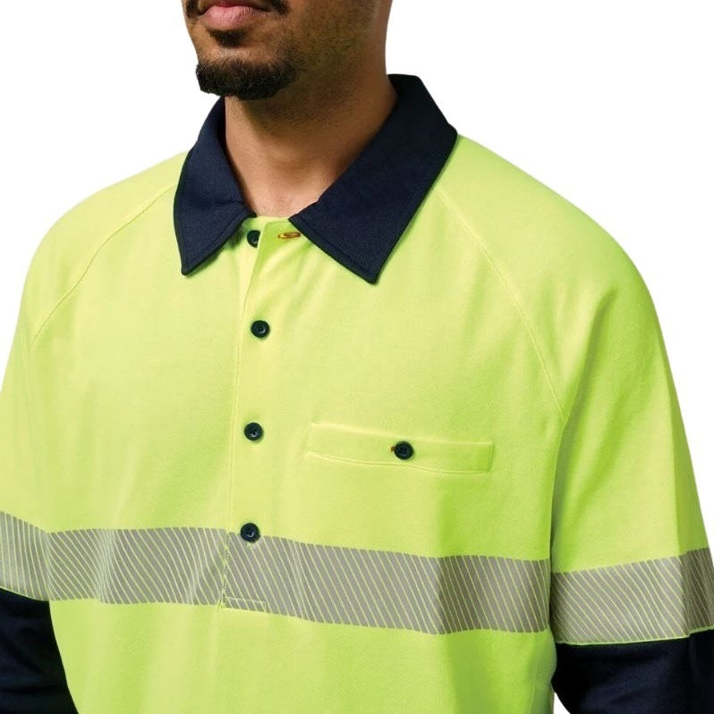 Person wearing a bright yellow safety shirt with reflective stripes on a white background