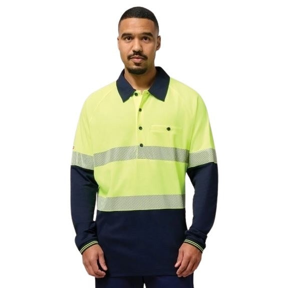 Man wearing a high-visibility work shirt with reflective stripes on a white background