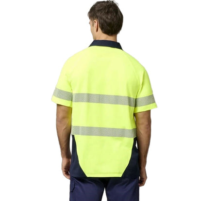 Person wearing a high-visibility yellow and navy work shirt on a white background