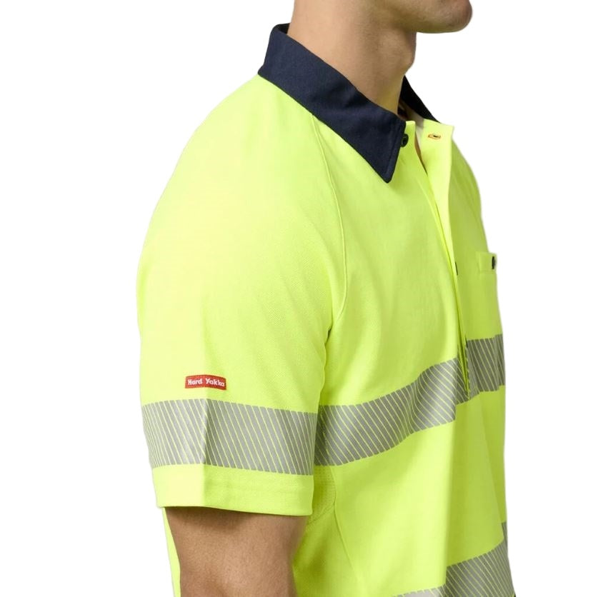 Yellow safety shirt with reflective stripes on a white background
