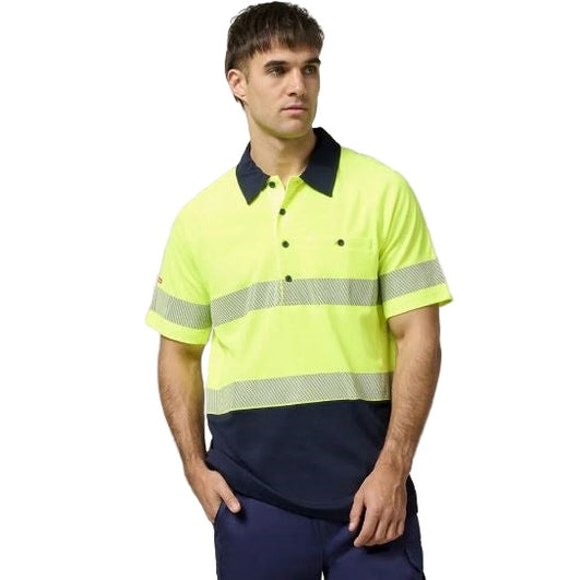 Man wearing a high-visibility yellow and navy work shirt on a white background