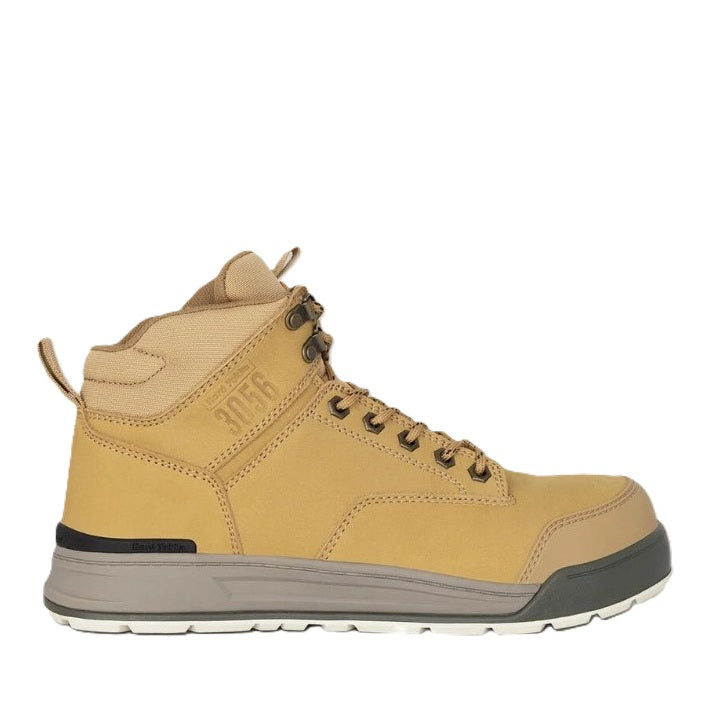 Tan hiking boot with black sole on a white background