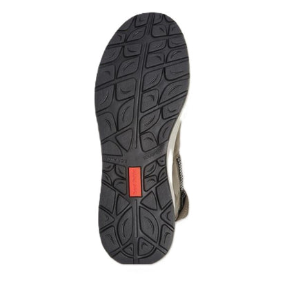 Sole of a shoe with tread pattern and a red label on a white background