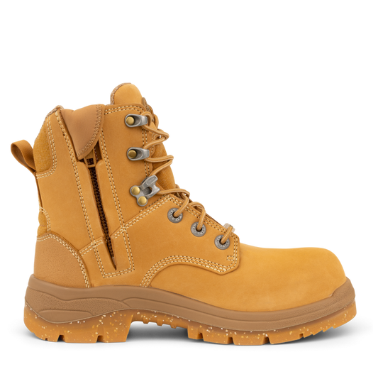Yellow work boot with brown sole on a white background