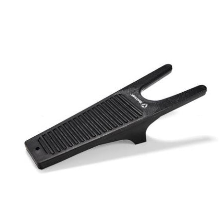 A black Yaktrax Boot Jack designed to remove boots with ease, featuring a unique shape and polypropylene construction.